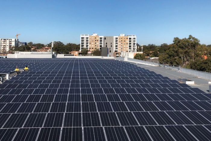 Property developer Stockland has pushed ahead in adoption renewable energy across its portfolio Solar panels on the roof of a Stockland property in Merrylands
