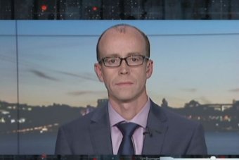Andrew Dillon speaks to The Business A headshot of a bald man with glasses, wearing a suit.