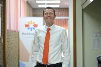 Sam Johnson A tall white man with an orange tie smiles at the camera