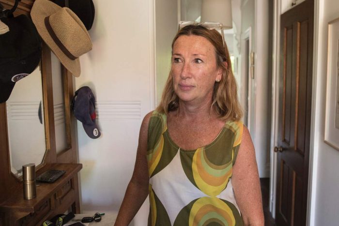 Monique Munro middle-aged woman in hallway